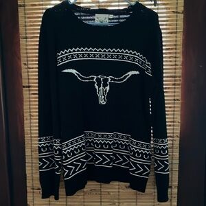 Black and white sweater with bullhead  size large
